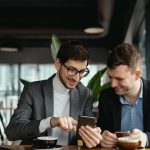 Business professionals using a mobile app to streamline operations